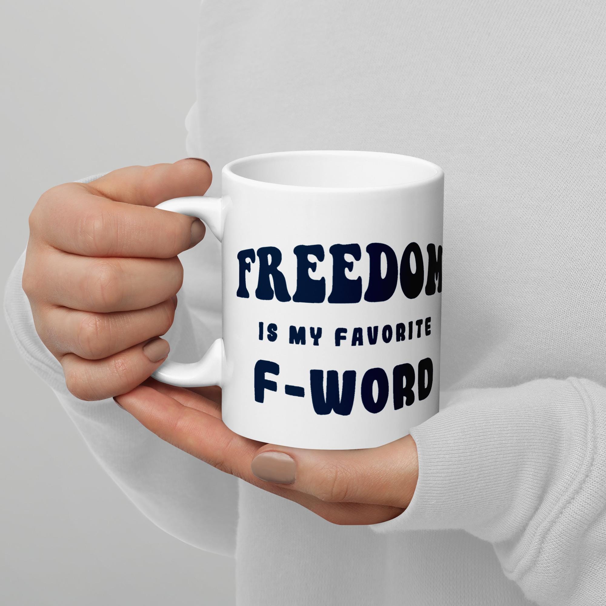 White glossy ceramic coffee mug printed with the phrase Freedom is My Favorite F-Word. Available in 11 oz, 15 oz, and 20 oz. Dishwasher and microwave safe, lead-free and BPA-free. A funny patriotic gift for liberty lovers and coffee drinkers.