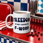 White glossy ceramic coffee mug printed with the phrase Freedom is My Favorite F-Word. Available in 11 oz, 15 oz, and 20 oz. Dishwasher and microwave safe, lead-free and BPA-free. A funny patriotic gift for liberty lovers and coffee drinkers.